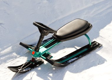 Green Children's sled (snowmobile, snowbicycle). clipart