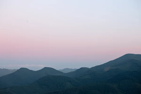 stock image Full moon under Carpathian mountains