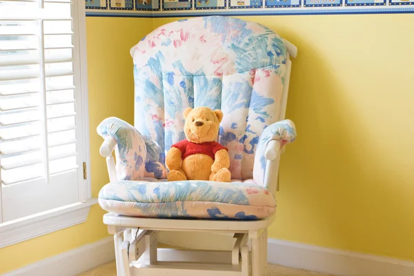 Teddy bear sitting in the armchair — Stock Photo, Image