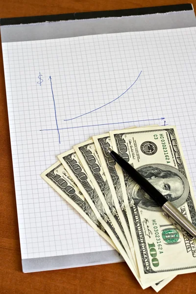 Pen and notepad with money — Stock Photo, Image