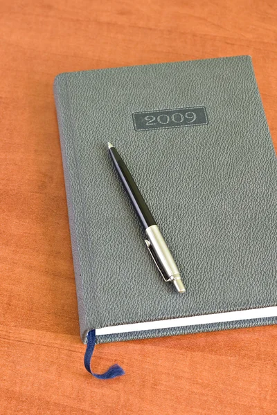 Pocket planner and pen — Stock Photo, Image
