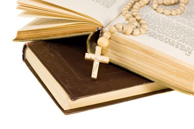 Holy bible opened with a cross on it clipart