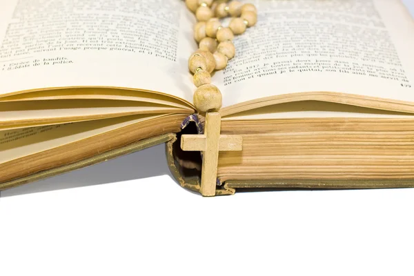 Book and wooden beads with cross — Stock Photo, Image