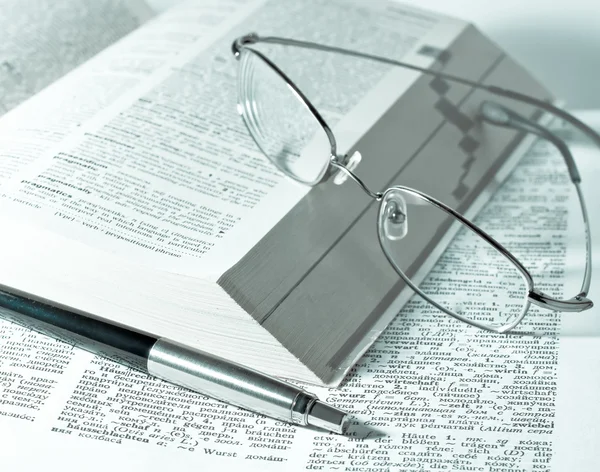 Close up of books, pen and glasses — Stock Photo, Image