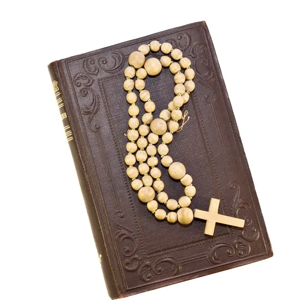 Rosary over an old holy bible — Stock Photo, Image
