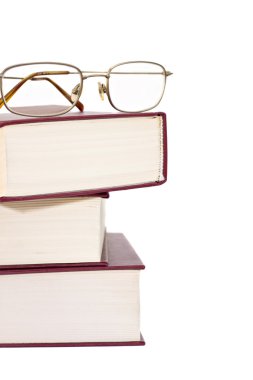 Stack of books with glasses clipart