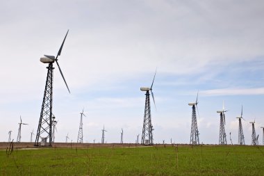 Field with wind energy converters clipart