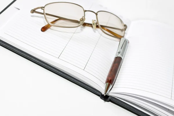 Organizer, glasses and pen — Stock Photo, Image