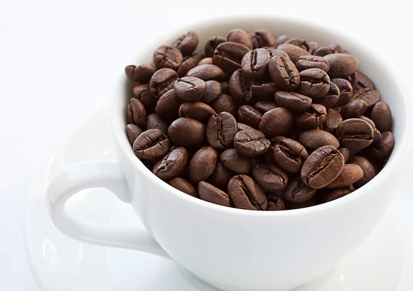 Coffee cup with coffee beans — Stock Photo, Image