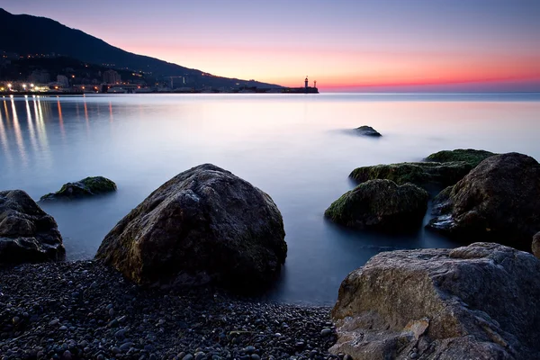 Sunrise over rocky black sea coastline — Stock Photo, Image