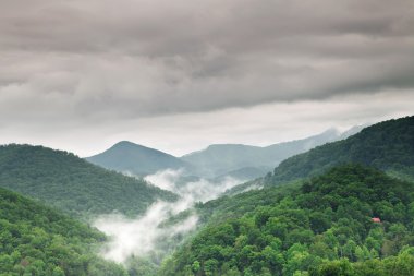 Early morning fog and cloud mountain valley landscape clipart