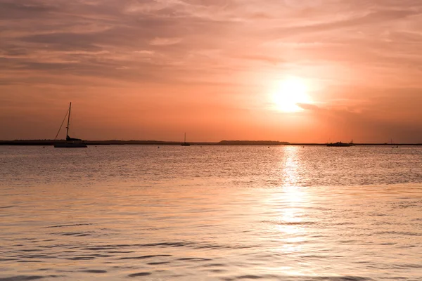 Sailing boat silhouette over sunset — Stock Photo, Image