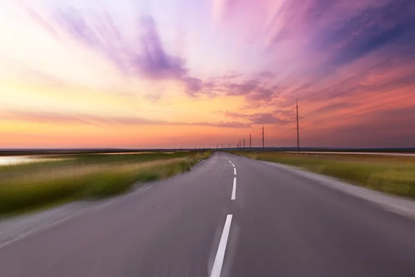 Empty blurry country road — Stock Photo, Image