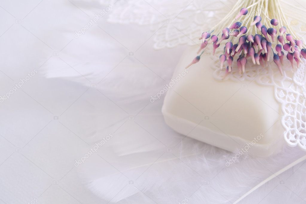 Soap embedded in feathers, lace and artificial flower