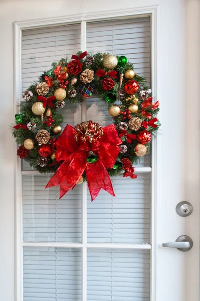 Karácsonyi koszorú ajtó Stock Kép