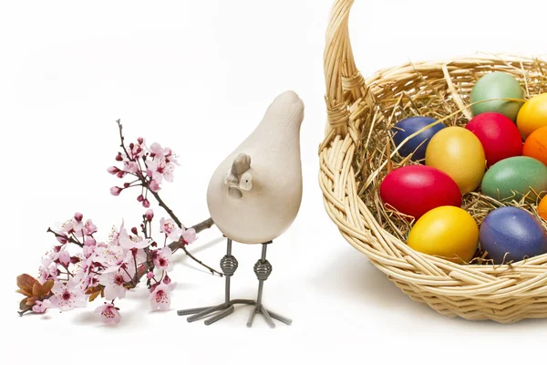 Painted easter eggs in a basket — Stock Photo, Image