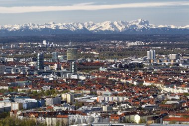 Munich with view of the bavarian alps at foehn wind clipart