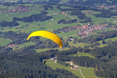 Paraglider in southern Bavaria, Germany clipart