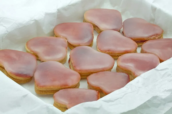 stock image Pink heart shaped christmas cookies in a box