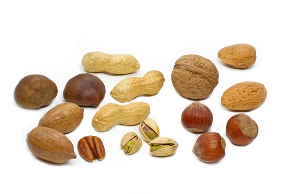 Selectie van noten op witte achtergrond — Stockfoto