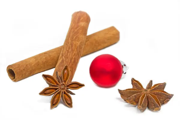 Cinnamon sticks with star aniseed and christmas ball — Stock Photo, Image