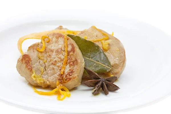Fillet of pork with orange sauce and laurel leaf — Stock Photo, Image