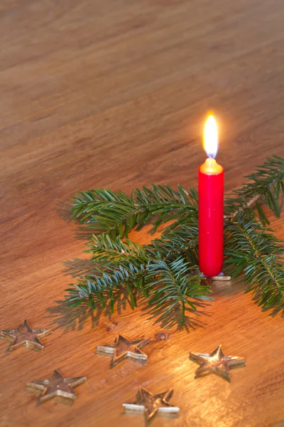 Christmas decoration with burning candle — Stock Photo, Image