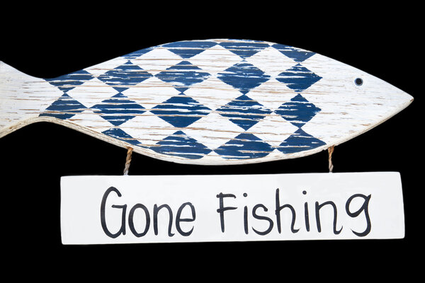 Wooden gone fishing sign, isolated on black background