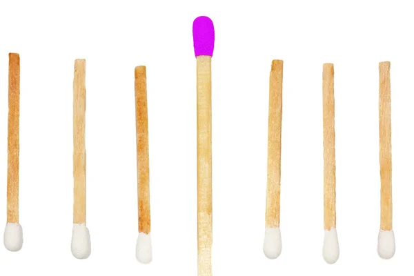 Six short matches and one large beeing different — Stock Photo, Image