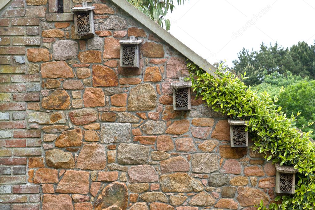 Small insect hotels on a house wall