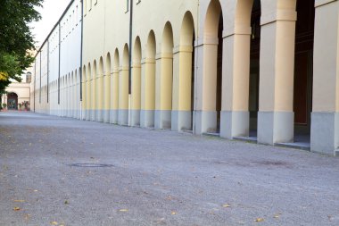 Arcade corridors inside the „Hofgarten“ park in Munich, Germany clipart