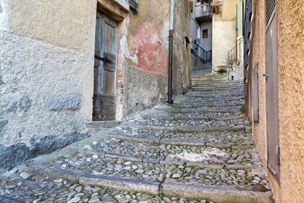 Picturesque alley in the small town of Varenna at lake Como, Italy