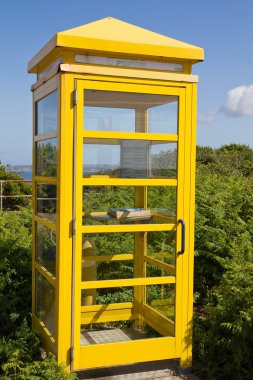 Typical phone booth on the island of Jersey (UK) clipart