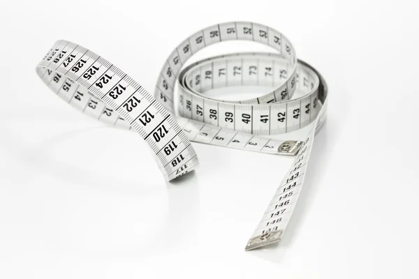 Measuring tape on white — Stock Photo, Image