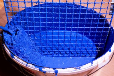 Blue paint in a bucket clipart