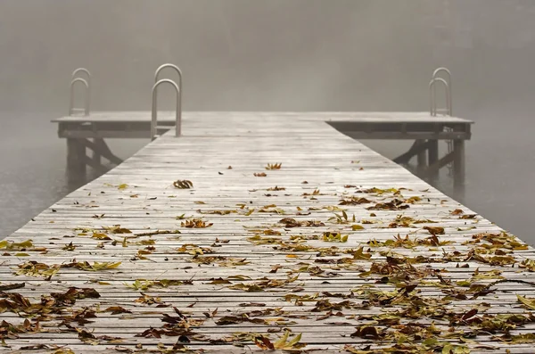 Jetty at a bathing lake in fog — Stock Photo, Image