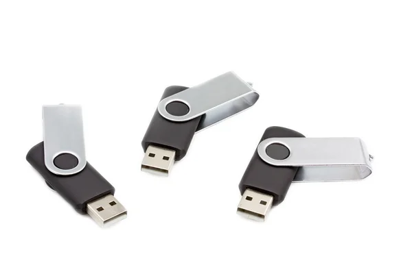 stock image Three portable usb flash drives on white background