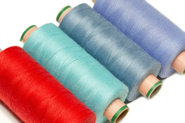 Bobbins of thread on white background — Stock Photo, Image