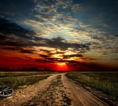 Countryside landscape with dirt road after rain, Russia clipart