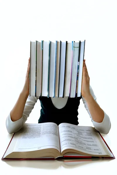 Het meisje en een heleboel leerboeken. het is geïsoleerd — Stockfoto