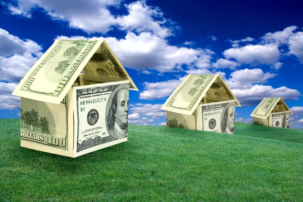 Three houses on a lawn — Stock Photo, Image