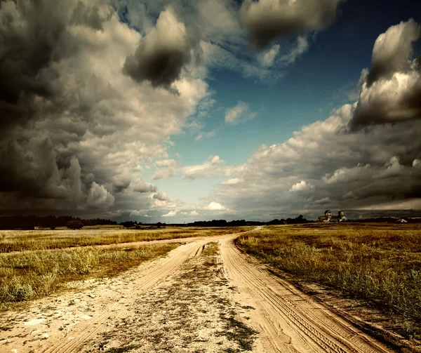 Countryside landscape with dirt road after rain, Russia — Stock Photo, Image