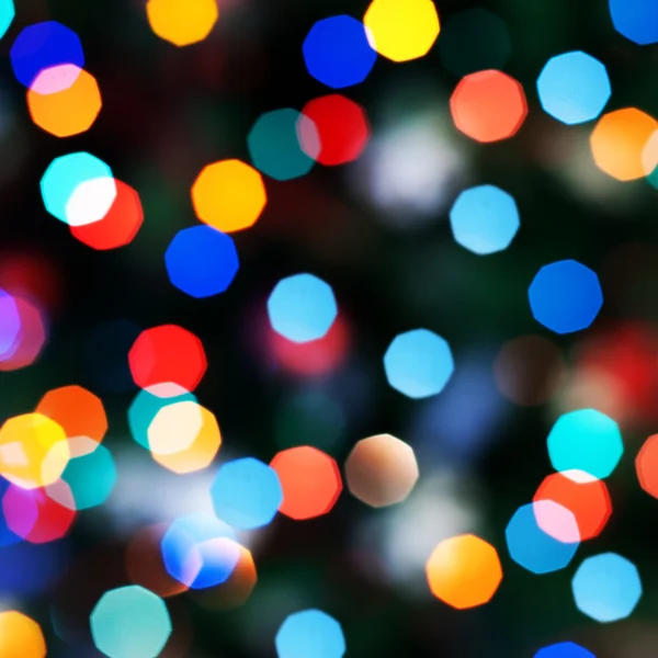Blurred festive colorful lights over black useful as background — Stock Photo, Image