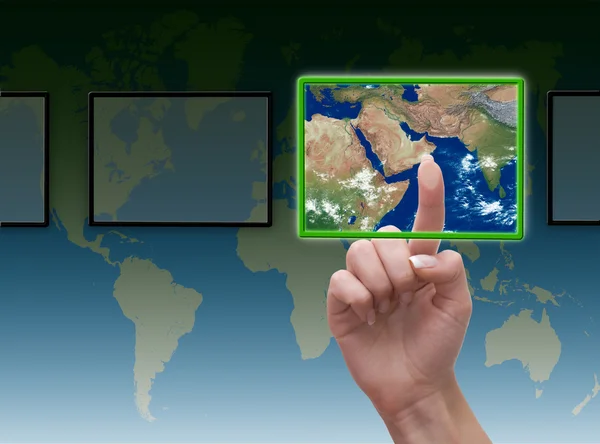 stock image Hand pressing touchscreen button on the world background