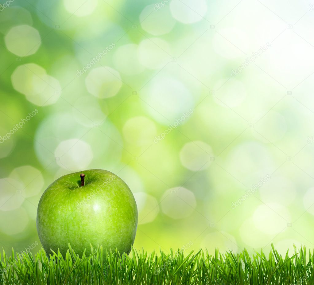 Apple on grass