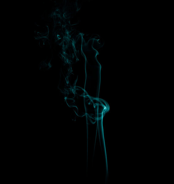 Abstract forms created with blue smoke isolated background