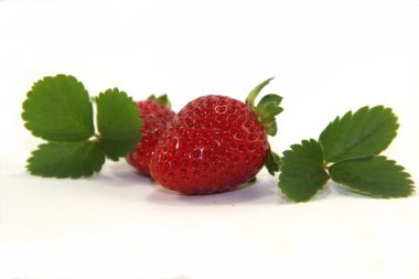 Two sweet strawberries with leaves clipart