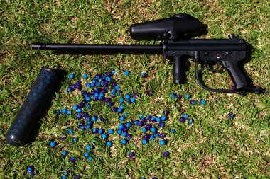 Paintball marker and pod with paintballs clipart