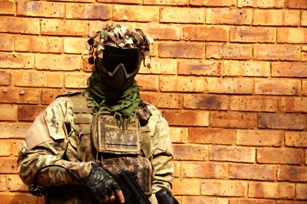 stock image Paintball player with a gun