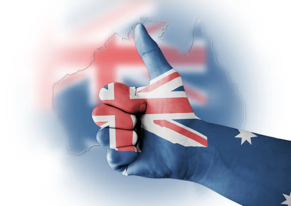 Pouce levée avec drapeau australien peint numériquement sur le corps Photo De Stock